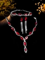 Detail shot of luxury red marquise zircon necklace set with earrings on a black display - Silver Red Waterdrop Tassel Three-piece Set (PJ--T0036--2)