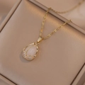 Elegant gold tulip pendant necklace with opal stone and zircon accents on jewelry box - X0075 Tulip Opal Look Style