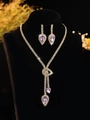 Elegant gold necklace and earring set with purple teardrop crystals on a black bust - Gold & Purple Waterdrop Jewelry Set (PJ--T0096--4)