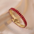 Luxurious gold open bracelet featuring red marquise cut zircon stones on silk background - Red (TS164)