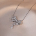 Elegant silver necklace with bow pendant, blue crystal drop, and zircon stones for women - Bowknot Teardrop Zirconia Style (X0294)