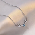 Reindeer antler necklace with blue marquise stone on soft silk fabric background - Antler Blue Zirconia Style (X0292)