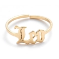 Detailed close-up of golden adjustable ring featuring Gothic Leo zodiac lettering - Gold-Leo