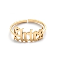 Detailed macro view of the gold Aries zodiac letter engraving on a minimalist open ring - Gold-Aries