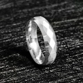 Detailed macro view of 6mm faceted stainless steel ring with geometric silver reflections - US 7 / Silver