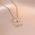 Elegant gold necklace with pink heart-shaped clover pendant on silk background - Pink (X2987)