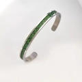 Close-up of stainless steel bangle with green luminous dragon scale pattern inlay - Steel Green Light Dragon