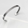 Macro shot of vintage silver open cuff bracelet with wheat pattern engraving - Vintage Braided Wheat Silver Style
