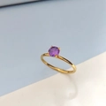 Minimalist gold stainless steel ring featuring a round purple zircon in a four-prong setting - US 6 / February Violet - Gold