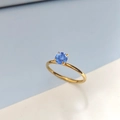 Elegant gold stainless steel ring with a round blue cubic zirconia in a four-prong setting - US 6 / March Light Blue - Gold