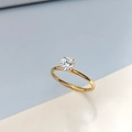 Classic gold birthstone ring featuring a round solitaire cubic zirconia in a four-prong setting - US 6 / April White - Gold
