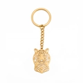 Portachiavi con testa di leone dorata in acciaio al titanio con design punk traforato trendy - Oro