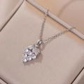 Silver-colored grape cluster necklace with sparkling zircon pendants on champagne silk background - Necklace with Pendant / Steel