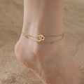 Double-layer gold stainless steel Om anklet with beads on a sandy beach setting - Ball Chain / Gold