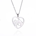 Silver stainless steel heart necklace featuring an elegant woman and horse silhouette - Steel