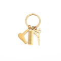 Golden stainless steel barber keychain featuring mini hair dryer, comb, and scissors charms - Gold
