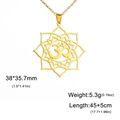 Detail of golden stainless steel lotus mandala pendant with sacred Om symbol engraving - Gold Yoga Symbol Flower