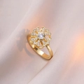 Rotating gold floral necklace with sparkling zircon snowflake pendant on soft fabric - Gold Snowflake Rotating Ring (J0310)