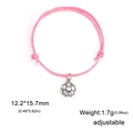 Adjustable pink cord sports bracelet featuring a detailed alloy football soccer charm - Pink