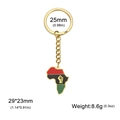 Porte-clés carte Afrique en acier doré avec design poing en émail coloré - Carte de l'Afrique / Or