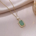 Elegant gold necklace with emerald-cut green crystal and zircon halo on satin fabric - Emerald Green(X3133)
