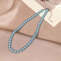Elegant light blue pearl necklace with adjustable silver clasp on silk background - 8mm / Blue