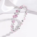 Detail of silver bangle with square cut pink and white zircon stones in rows - Pink