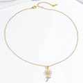 Elegante goldene Halskette mit funkelndem Gänseblümchen-Anhänger und grünem Blatt-Detail - Goldene Gänseblümchen-Halskette
