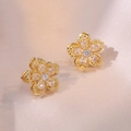 Golden cherry blossom stud earrings with pear-cut zircon petals on pink silk background - White Bauhinia Earrings
