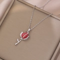 Macro shot of 3D red tulip pendant in silver steel with shimmering leaf details - Tulip Necklace (X3768) / Red
