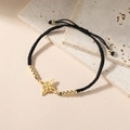 Bracciale regolabile in cordino nero con ciondolo a nodo di strega dorato e perle celtiche - modello 2 / Nero