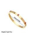 Detail of 18K gold plated stainless steel bangle with flower and heart motifs - Gold Red