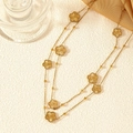 Elegante gouden dubbellaagse trui ketting met getextureerde vijf-blad bloem hangers - A-077 Extra Lange Trui Ketting