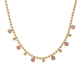 Detail showing 18k gold bead chain necklace with pink zircon pendants on a white background - Pink