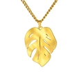 Golden monstera leaf pendant necklace with a twist chain on a clean white background - Rope Chain / Gold