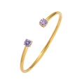 Detail of gold cuff bracelet featuring round purple cubic zirconia in four-prong settings - Purple Style (TT0414)