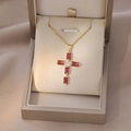 Close-up of golden cross necklace with red stones in a luxury gift box packaging - Gold Multicolor Rectangular Zircon Cross (X2556)