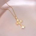 Close-up of gold cross pendant with cubic zirconia inlay on elegant satin background - Radiant Center Stone Style (X4473)