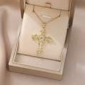 Detailed macro view of vintage gold cross necklace with pearls and zircon in a luxury gift box - Vintage Scroll Pattern Artificial Pearl Gold Cross Style (X4601) / Gold