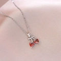 Close-up of cherry pendant necklace featuring red heart stones and crystal leaves - Heart Red Zirconia Cherry (X4431) / Silver