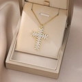 Detail of cross pendant necklace with sparkling white stones in a gold gift box - Micro-inlaid White Zirconia Gold Cross Style (X4595) / Gold