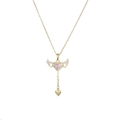 Macro shot of gold angel wing necklace featuring a pink heart gem and tassel charm - Gold Pink Heart Angel Wings (X4583)