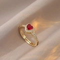 Golden heart ring with red gemstone and white zircon accents in an open adjustable design - Red Heart Main Stone / Red/Gold (J0601)