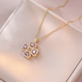 Collana in oro con pendente a quadrifoglio con quattro pietre viola a forma di cuore - Collana Cuore Rotante Viola