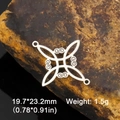 Macro detail of a silver stainless steel Celtic knot pendant on a natural stone background - Witch Knot S-Shape / Steel