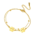 Detail van dubbellaagse roestvrijstalen gouden ketting met pootafdrukken en kralen - Dubbele Laag - Twee Pootafdrukken / Goud