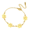 Gouden roestvrijstalen schakelarmband met vier bedels van katten- en hondenpoten en sluiting - Enkele Laag - Vier Pootafdrukken / Goud