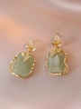 Macro shot of gold leaf earrings with turquoise stones and shimmering zircon inlay - Earrings Only (Without Necklace) (E1223)