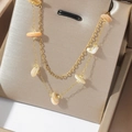 Detail of double-layer gold necklace featuring irregular natural stone beads on display - White Shell Stone Style (T0571)
