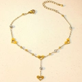 Golden heart and zircon anklet with adjustable chain on a stone surface background - Hollow Heart Claw Zircon Style (TL0017)